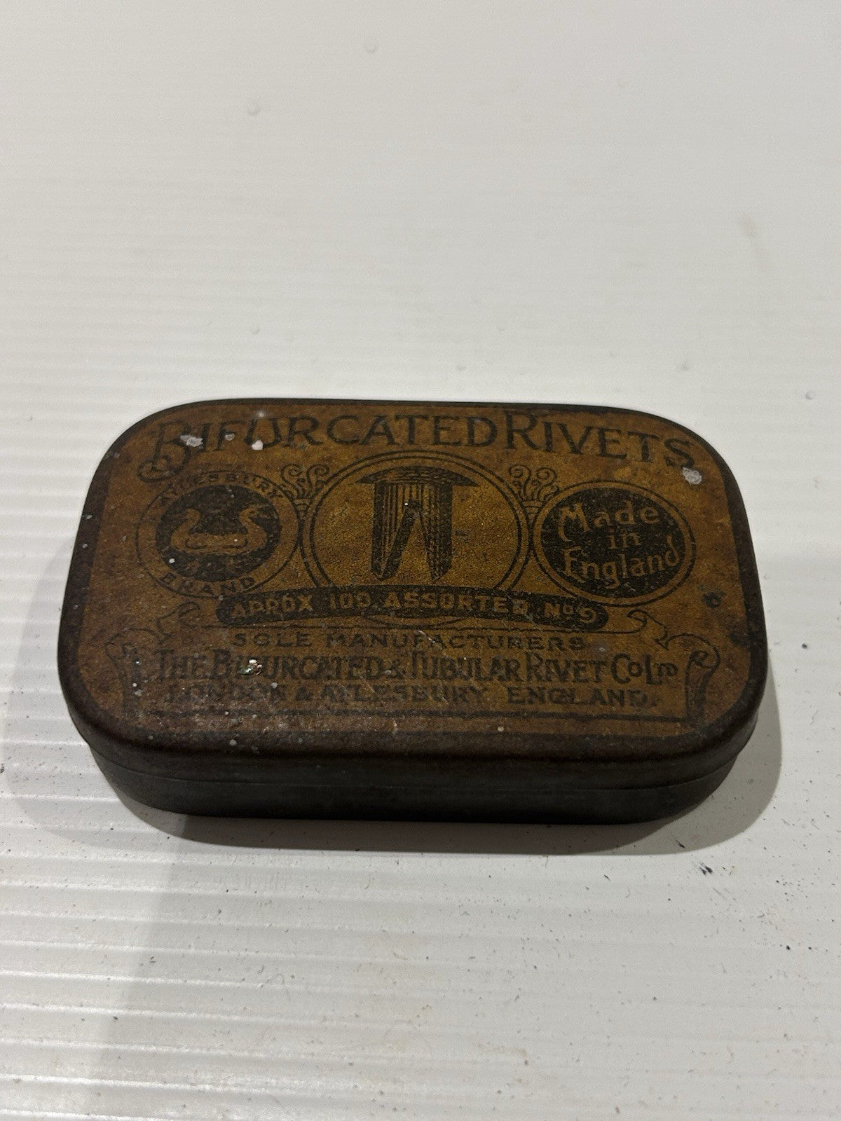Bifurcated rivets vintage tin classic collectable.
