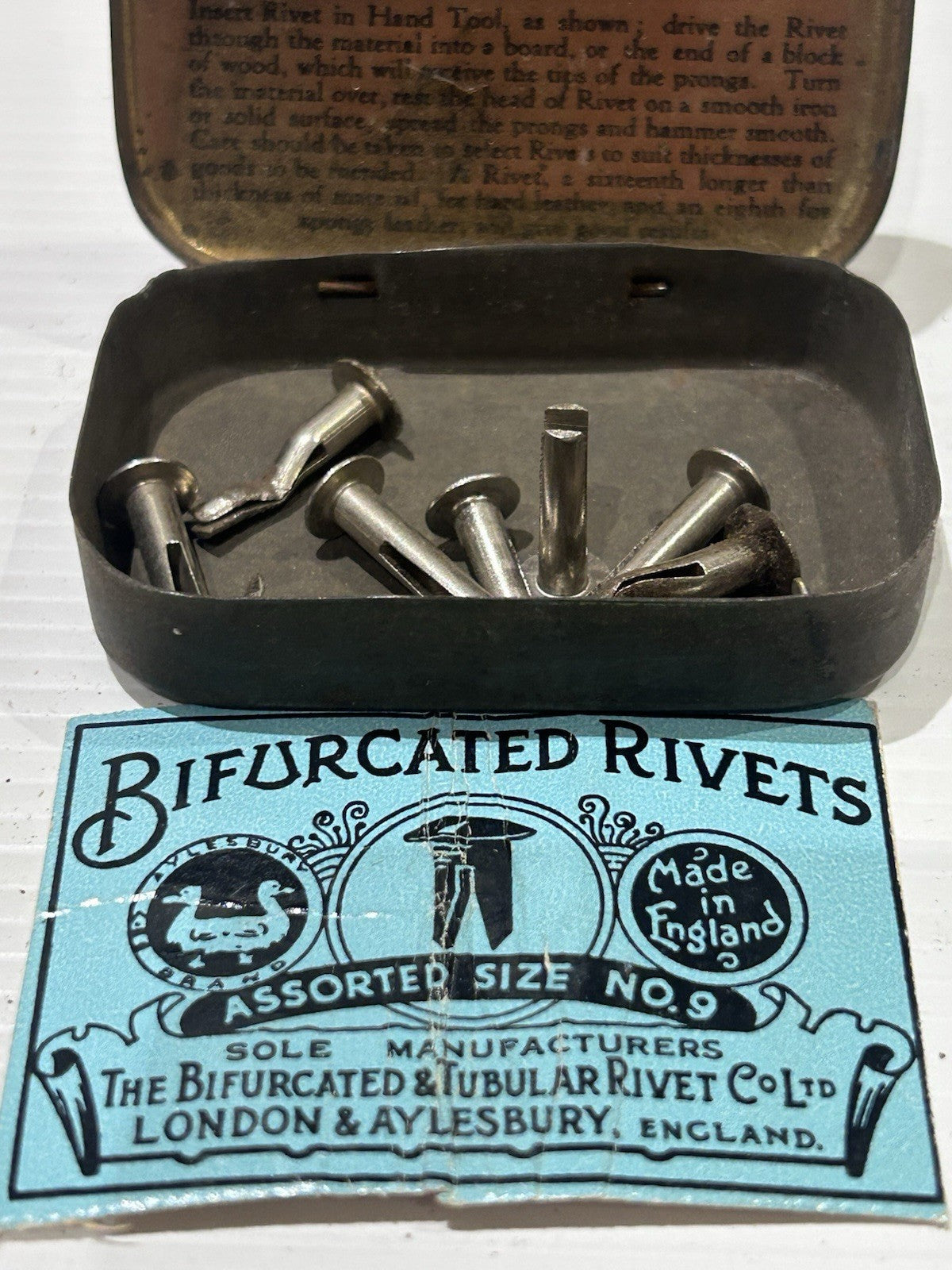 Bifurcated rivets vintage tin classic collectable.
