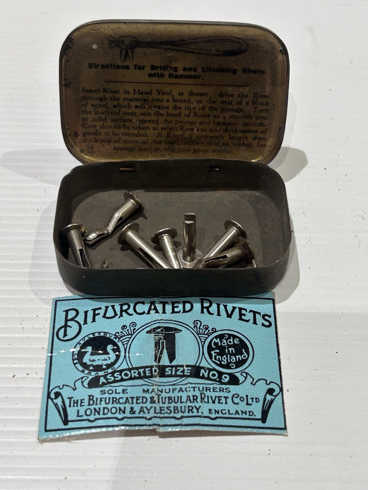 Bifurcated rivets vintage tin classic collectable.