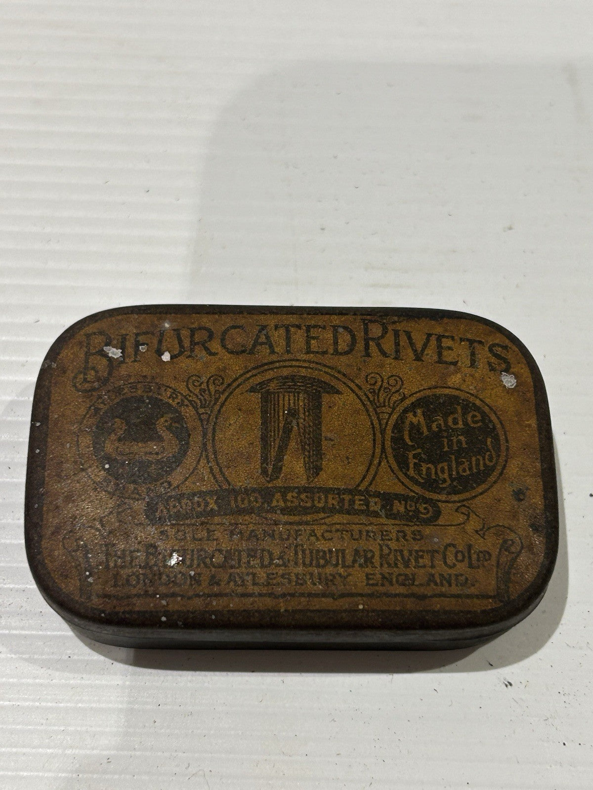 Bifurcated rivets vintage tin classic collectable.