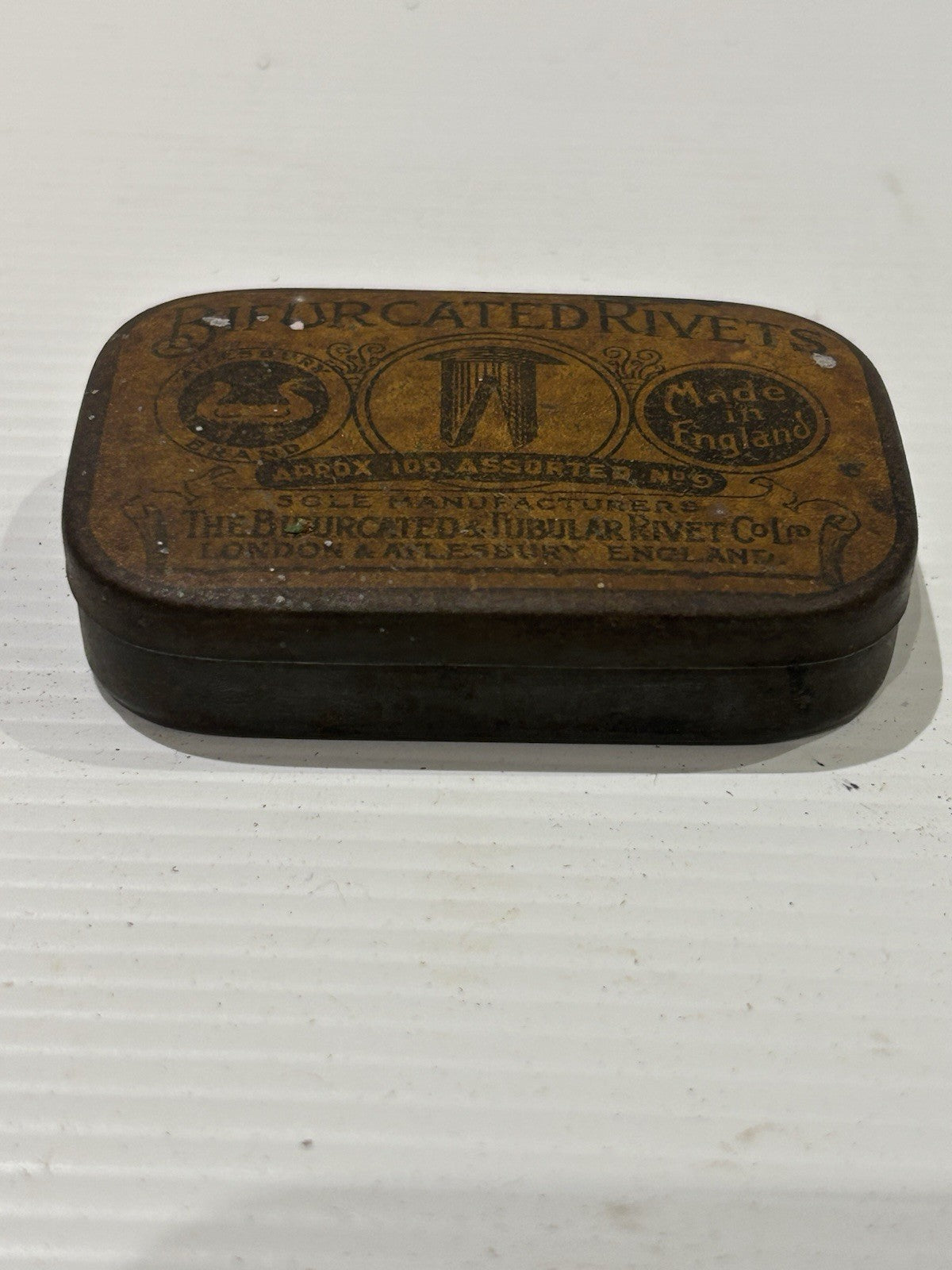 Bifurcated rivets vintage tin classic collectable.